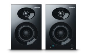 Clear Bass Studio Monitors Pair with Wood Cabinets for Precision Mixing